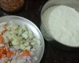 A picture of step 1 of Onion Cucumber Tomato Raita.