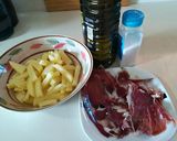 Foto del paso 1 de la receta Patatas fritas en el horno con jamón y huevos