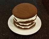 A picture of step 20 of Mocha Layer Cake with Whipped Mascarpone Cream and a Coffee Glaze Drizzle.