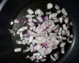 A picture of step 2 of Sauteed Sukuma Wiki with Toasted Cashew Nuts.