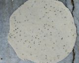 A picture of step 3 of Kashmiri Khatte Baigan with Khasta Puri.