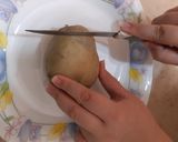 A picture of step 2 of Hasselback Potatoes.