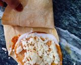 A picture of step 7 of Tortilla Wrap with egg and veggies.