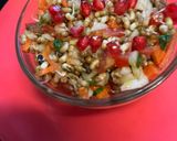 A picture of step 3 of Sprout Salad with carrots cucumber tomatoes.