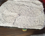 A picture of step 4 of Cookies and cream poke cake.