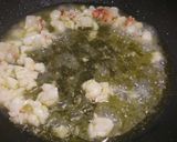 A picture of step 3 of Mezzi paccheri con arogosta al nero di seppia.