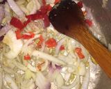 A picture of step 3 of Fish peepered soup garnish with parsely.