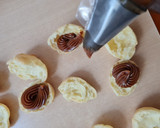 Foto del paso 5 de la receta: Buñuelos Choux rellenos de dulce de leche 💣 Profiteroles de dulce de leche