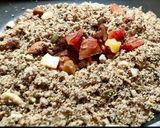 A picture of step 3 of Wheat flour seeds and nuts Ladoo with leftover ghee residue.