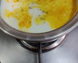 A picture of step 1 of Turmeric Cardamom Milk.
