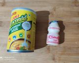 A picture of step 1 of Virgin Yakult Pina Colada topped with Whipped Cream.