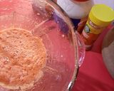 A picture of step 2 of Fried yam coated with egg and spicy fry sauce.