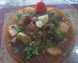 A picture of step 4 of Alloo gosht.