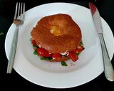 A picture of step 7 of My Crispy Bacon on Wholemeal 🥯 with 🍅 and 🥚 also Spinach.