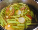A picture of step 6 of Salmon & Kang Kong in Tamarind Broth : Filipino Fish Sinigang > Savoury Sour Soup vs Tom Yum.