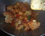 A picture of step 22 of Aloo fulcopi katla rosha ar misti doi.
