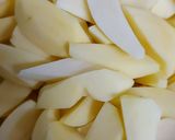 A picture of step 4 of Roast potatoes, carrots served with cabbage and kachumbari.