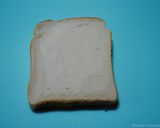 A picture of step 1 of Eggs in bread basket.