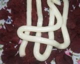 A picture of step 8 of Red Velvet çhoçolate inside Cupcakes with cream cheese frosting.