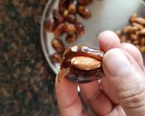 A picture of step 2 of Chocolate almonds dates.
