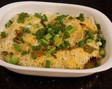 A picture of step 22 of Crab and Shrimp Enchiladas with Hatch Chili Sauce.