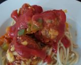 A picture of step 3 of My chilli +Garlic Meatballs on top of spaghetti.
