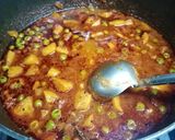 A picture of step 3 of Masala laccha paratha with aloo matar in tomato gravy.