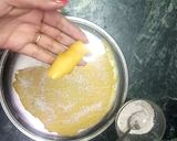 A picture of step 12 of Shahi mango khandvi with Mango rabari.