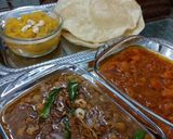 A picture of step 4 of Allu ki bhaji with pori.