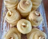 Une image de l'étape 2 de Pommes au four farcies à la banane jus au rhum toppings raisins secs et noisettes 🍎🍏.