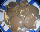 A picture of step 12 of Semolina cookies with chocolate syrup.