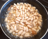 Foto del paso 6 de la receta: Merluza Rebozada con alubias al ajillo