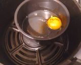 A picture of step 3 of Air Fryer Baked Sunnyside Up Egg.