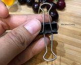 A picture of step 3 of #HowTo “Pit Cherries” with a binder clip? - Tuesday Tip.