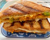 A picture of step 10 of Grilled Schezwan Aloo cheese sandwiches.