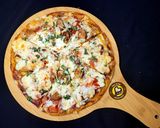 A picture of step 11 of Cheese Burst Veggies And Chicken Pizza From Scratch.