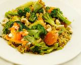 A picture of step 6 of Multi colored pilaf with broccoli, red and orange bell peppers, and carrots.