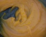 A picture of step 5 of Custard Powder Halwa cake mango flavour.