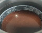 A picture of step 3 of Brownie cake with chocolate syrup.