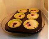 A picture of step 7 of Orange black berry muffins.