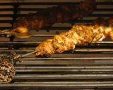 A picture of step 5 of Chicken satay kebabs and home made pili pili cheesy chapati nachos in the jiko oven :).