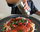 A picture of step 2 of Buffalo style + pepperoni pizza.