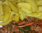 A picture of step 13 of Baked potato wedges served with beef.