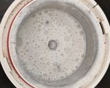 A picture of step 4 of Kavuni arisi coconut milk sweet.
