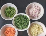 A picture of step 1 of Vegetable suji upma.