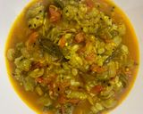 A picture of step 6 of Turaii (Ridge gourd) with kalonji and curry leaf.