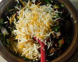 A picture of step 3 of Mexican Enchilada With black bean, cheese, black olives and etc. Stuffing.
