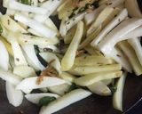 A picture of step 2 of Garlic Potato Wedges.