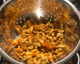 A picture of step 6 of Tray bake pumpkin & chicken thighs topped with roast pumpkin seeds.