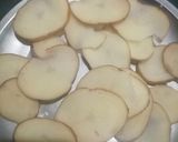 A picture of step 2 of Aloo and mirchi bajji with corn flour.